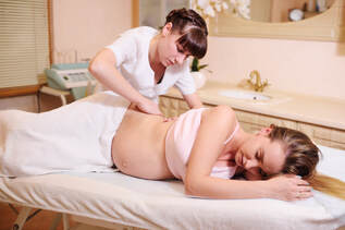 Prenatal massage therapy for pregnant woman